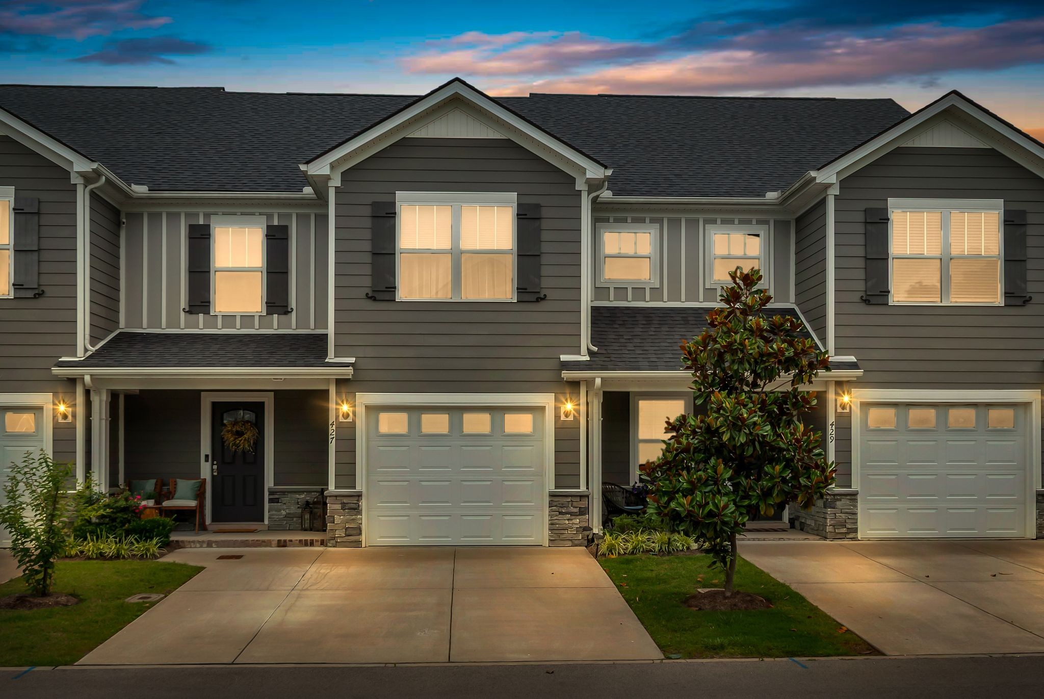 a front view of a house with garden