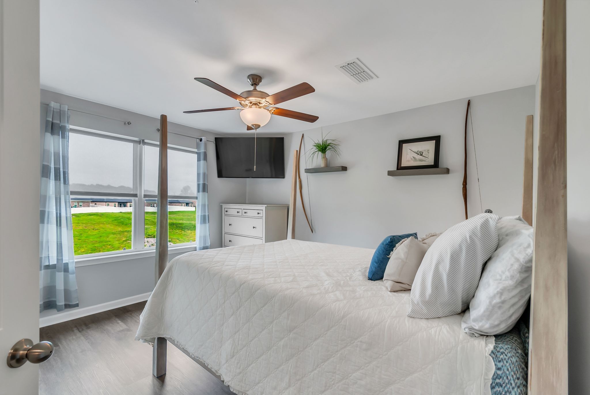 427 Tristan Way Spring Hill Spring Hill, TN 37174 - Photo 21 of 41 a bedroom with a bed a fireplace and a large window