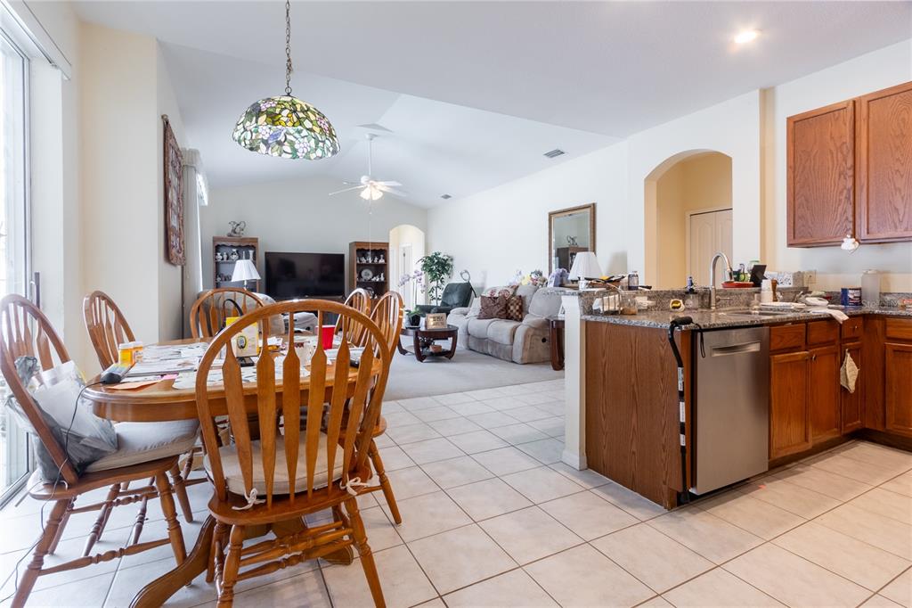 1812 Flower Branch Way Valrico, FL 33594 - Photo 12 of 42 a view of a dining room with furniture