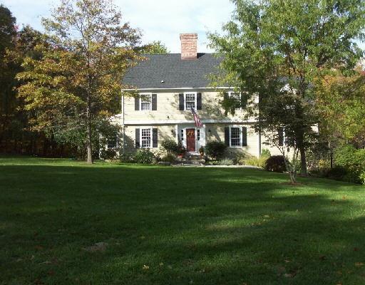 93 Hulda Hill Road Wilton, CT 06897 - Photo 1 of 1 a front view of a house with a garden