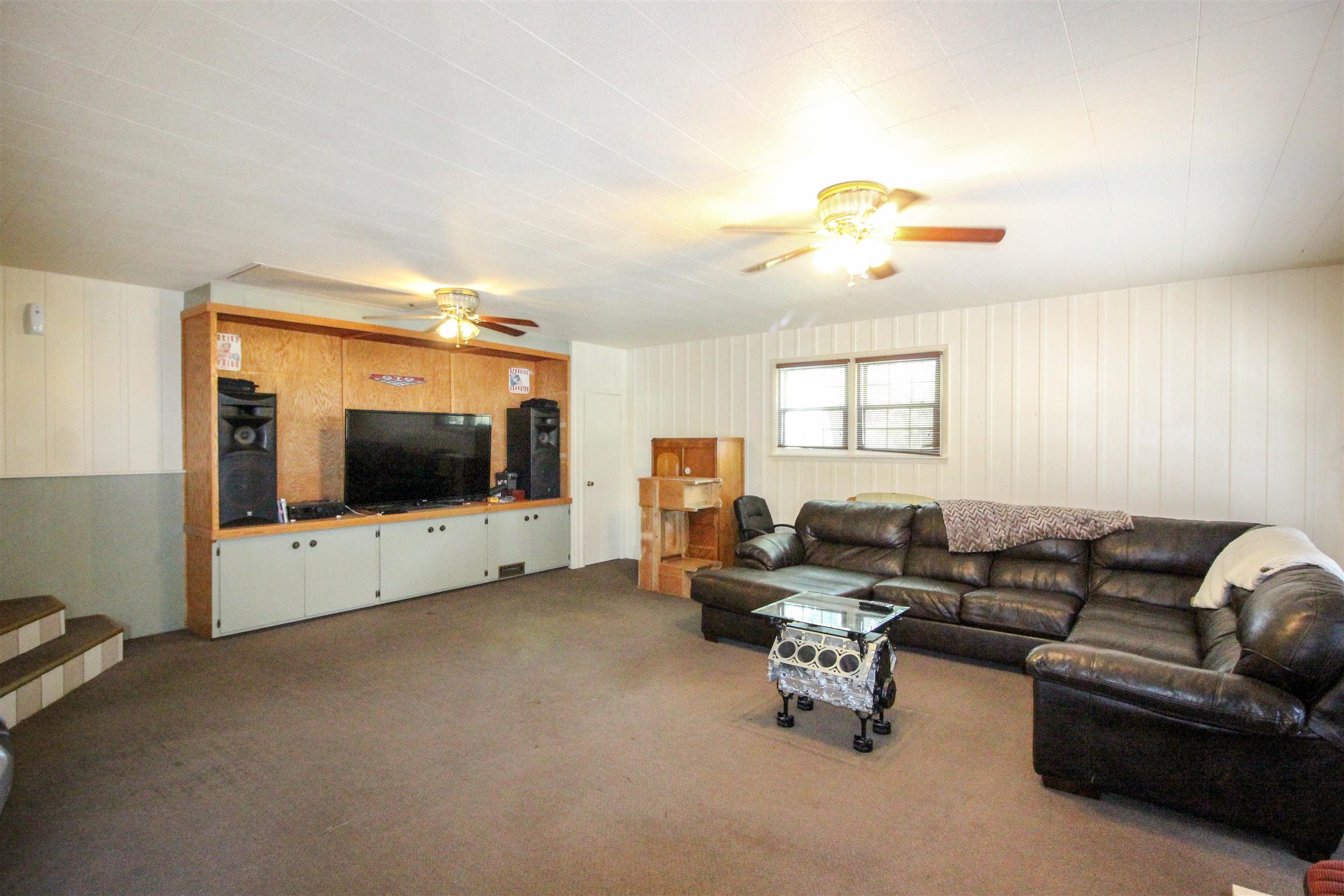 4530 Noah Road Beechgrove, TN 37018 - Photo 17 of 27 a living room with furniture and a flat screen tv