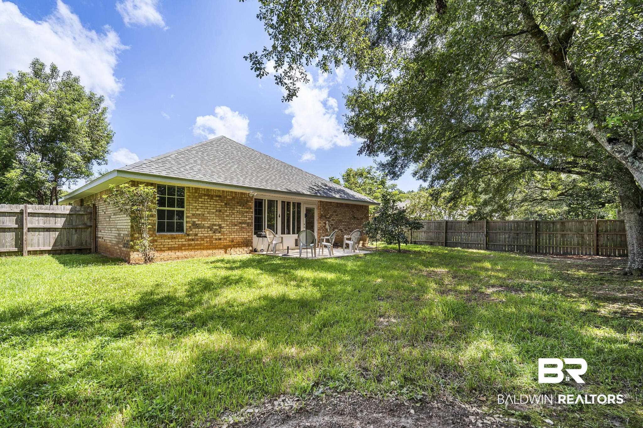 9814 Woolrich Avenue Fairhope, AL 36532 - Photo 25 of 29 View of yard with a patio