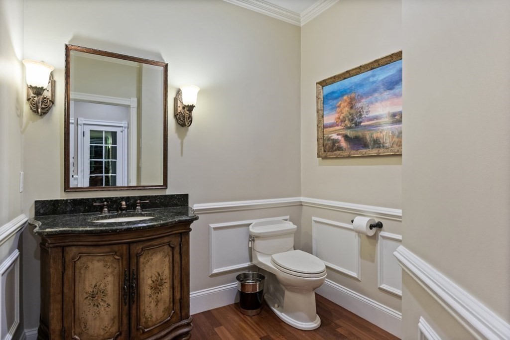56 Mill Brook Avenue Walpole, MA 02081 - Photo 19 of 42 a bathroom with a toilet a sink and mirror