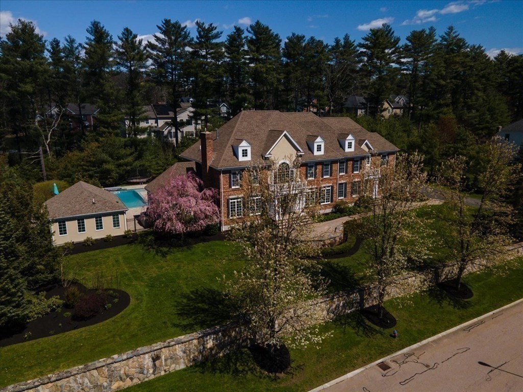 56 Mill Brook Avenue Walpole, MA 02081 - Photo 2 of 42 a front view of a house with garden