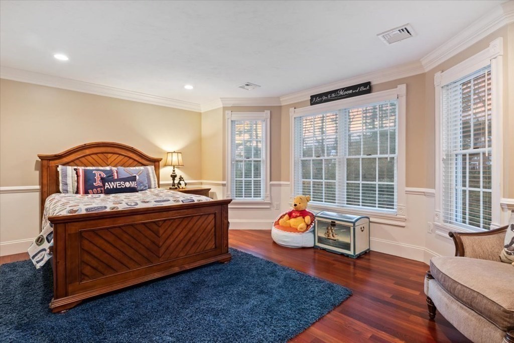 56 Mill Brook Avenue Walpole, MA 02081 - Photo 22 of 42 a bedroom with a bed and wooden floor