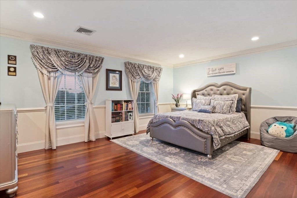 56 Mill Brook Avenue Walpole, MA 02081 - Photo 24 of 42 a spacious bedroom with a bed and a wooden floor
