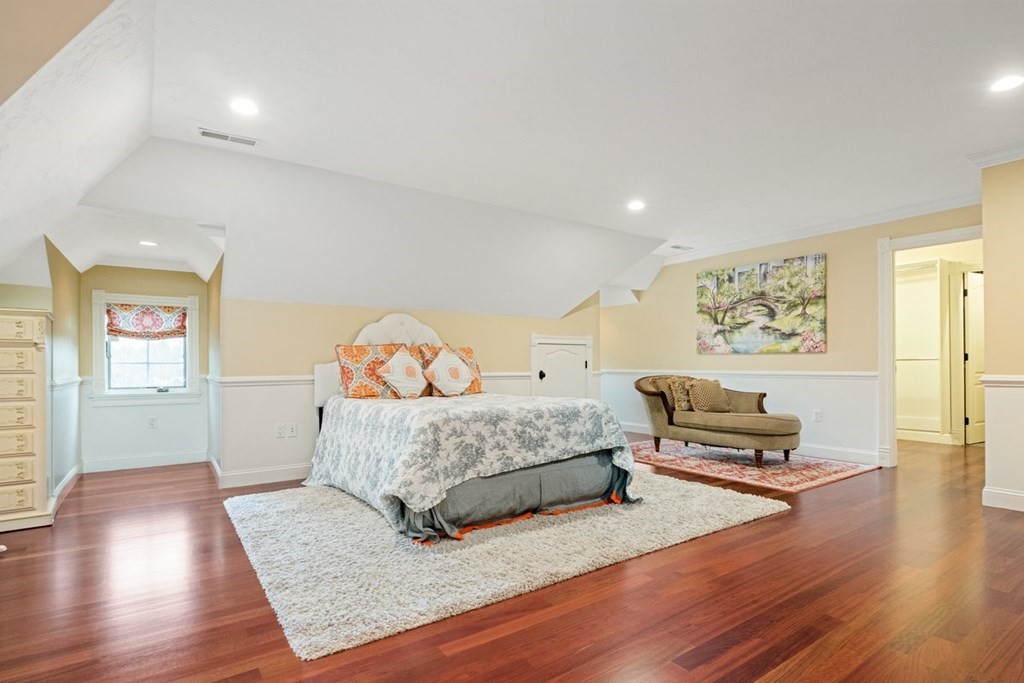 56 Mill Brook Avenue Walpole, MA 02081 - Photo 25 of 42 a bedroom with a bed and wooden floor