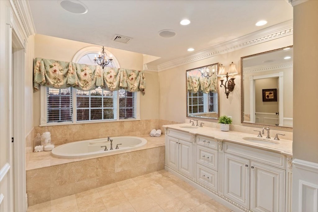56 Mill Brook Avenue Walpole, MA 02081 - Photo 28 of 42 a spacious bathroom with a tub sink and mirror