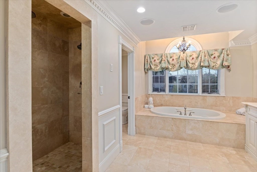 56 Mill Brook Avenue Walpole, MA 02081 - Photo 29 of 42 a bathroom with a large tub shower and large window