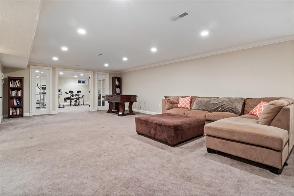 56 Mill Brook Avenue Walpole, MA 02081 - Photo 31 of 42 a living room with furniture and a large window