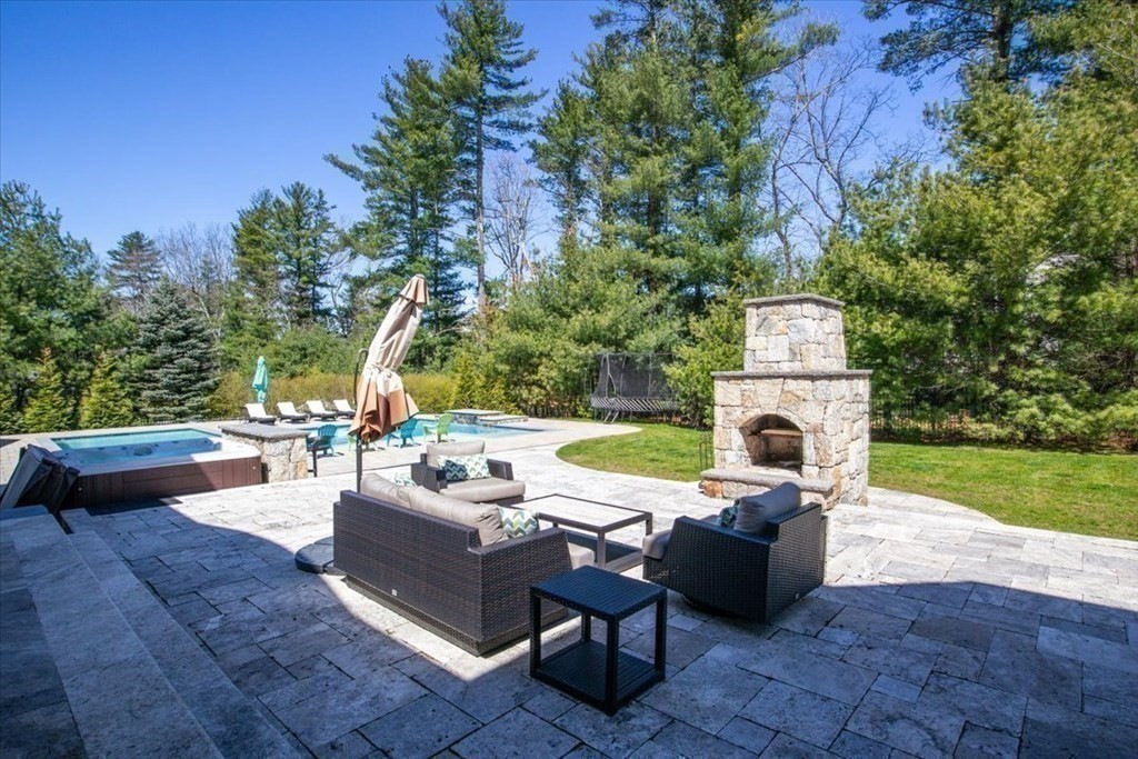 56 Mill Brook Avenue Walpole, MA 02081 - Photo 33 of 42 a view of a couches in a patio with a yard