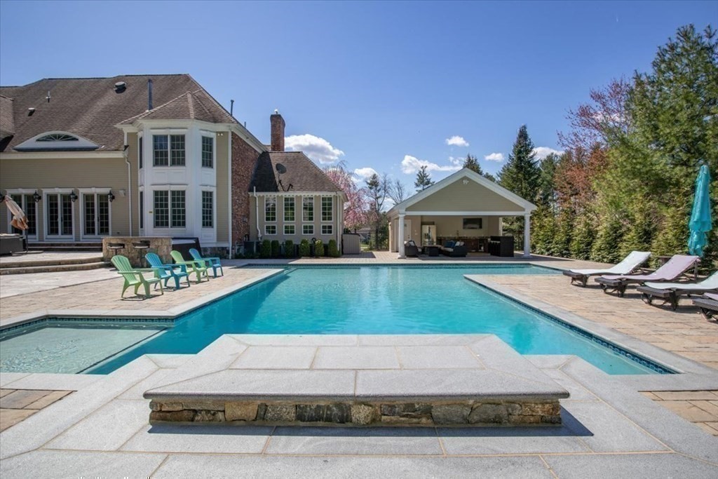 56 Mill Brook Avenue Walpole, MA 02081 - Photo 37 of 42 a front view of house with yard and green space