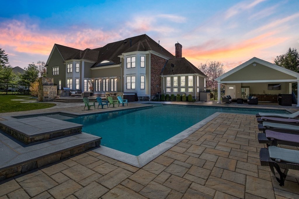 56 Mill Brook Avenue Walpole, MA 02081 - Photo 41 of 42 a front view of a house with a yard