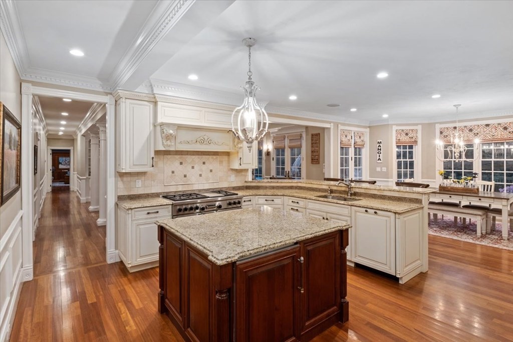 56 Mill Brook Avenue Walpole, MA 02081 - Photo 8 of 42 a kitchen with a stove sink and cabinets