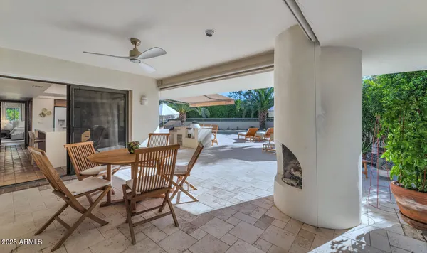 swimming pool view with a seating space