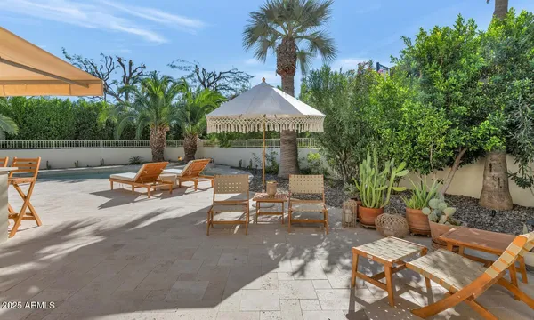 an aerial view of a house with a yard and garden