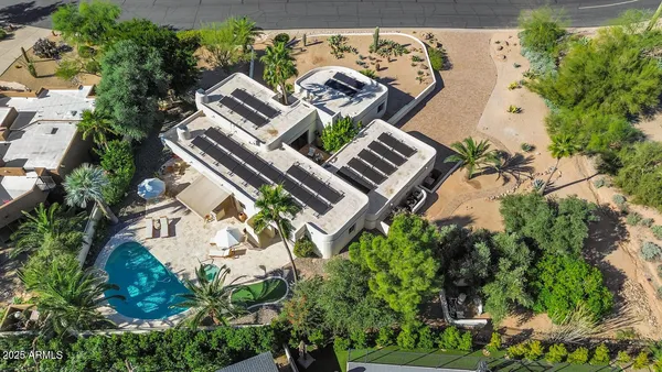 an aerial view of a house with mountain view
