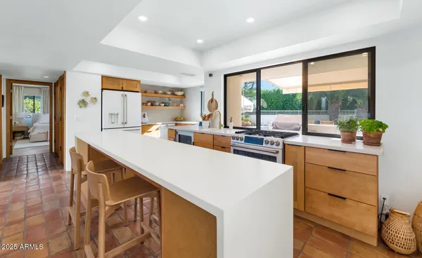 a kitchen with a stove and a sink