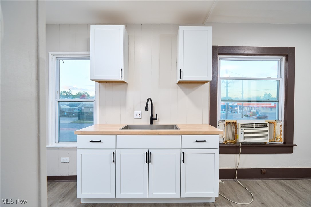 5432 State Road Parma, OH 44134 - Photo 29 of 47 Kitchen with white cabinets, light wood-style flooring, and butcher block counters