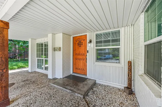 a front view of a house with a large window