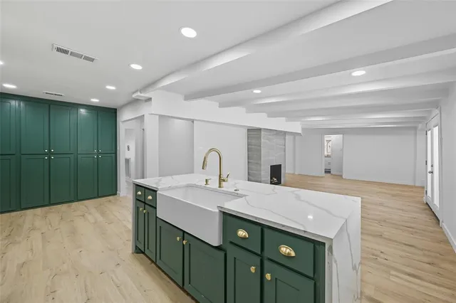 a spacious bathroom with a sink double vanity and a mirror