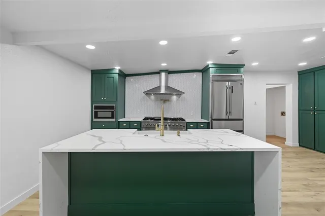 a large kitchen with a counter space