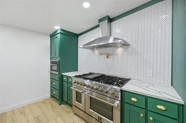 a kitchen with a stove and a refrigerator