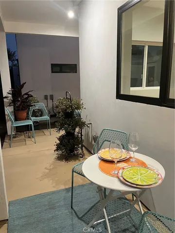 a kitchen with stainless steel appliances kitchen island granite countertop a stove a refrigerator and a microwave