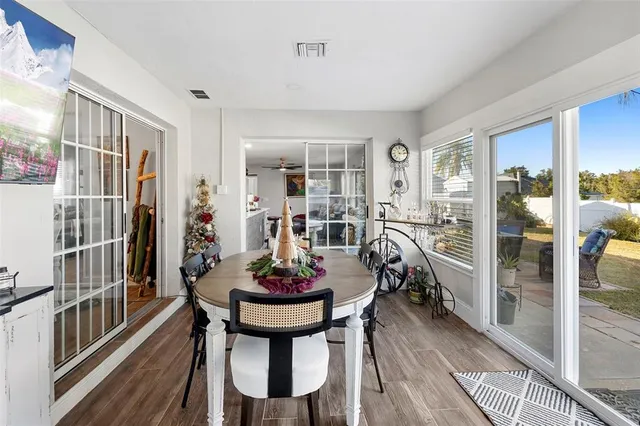 a view of a dining room with furniture and window