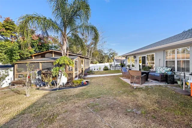 a view of a backyard with a patio