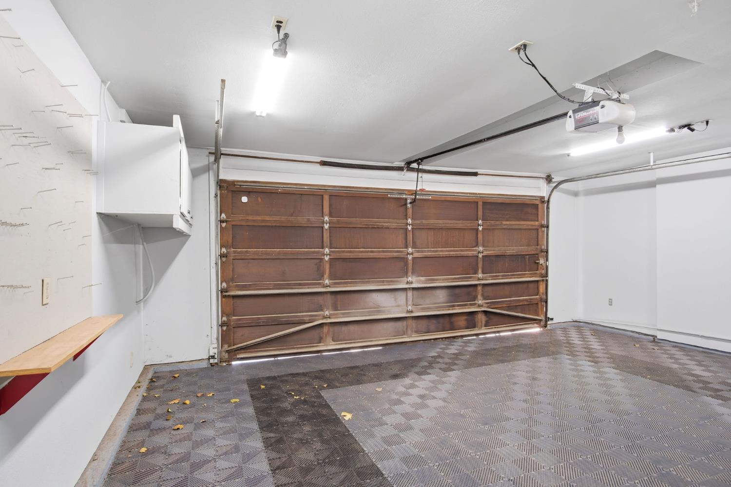 16166 Lawrence Road Escalon, CA 95320 - Photo 36 of 56 a view of an empty room with wooden floor and a window