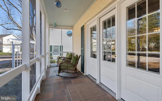 a view of living room with furniture and floor to ceiling window