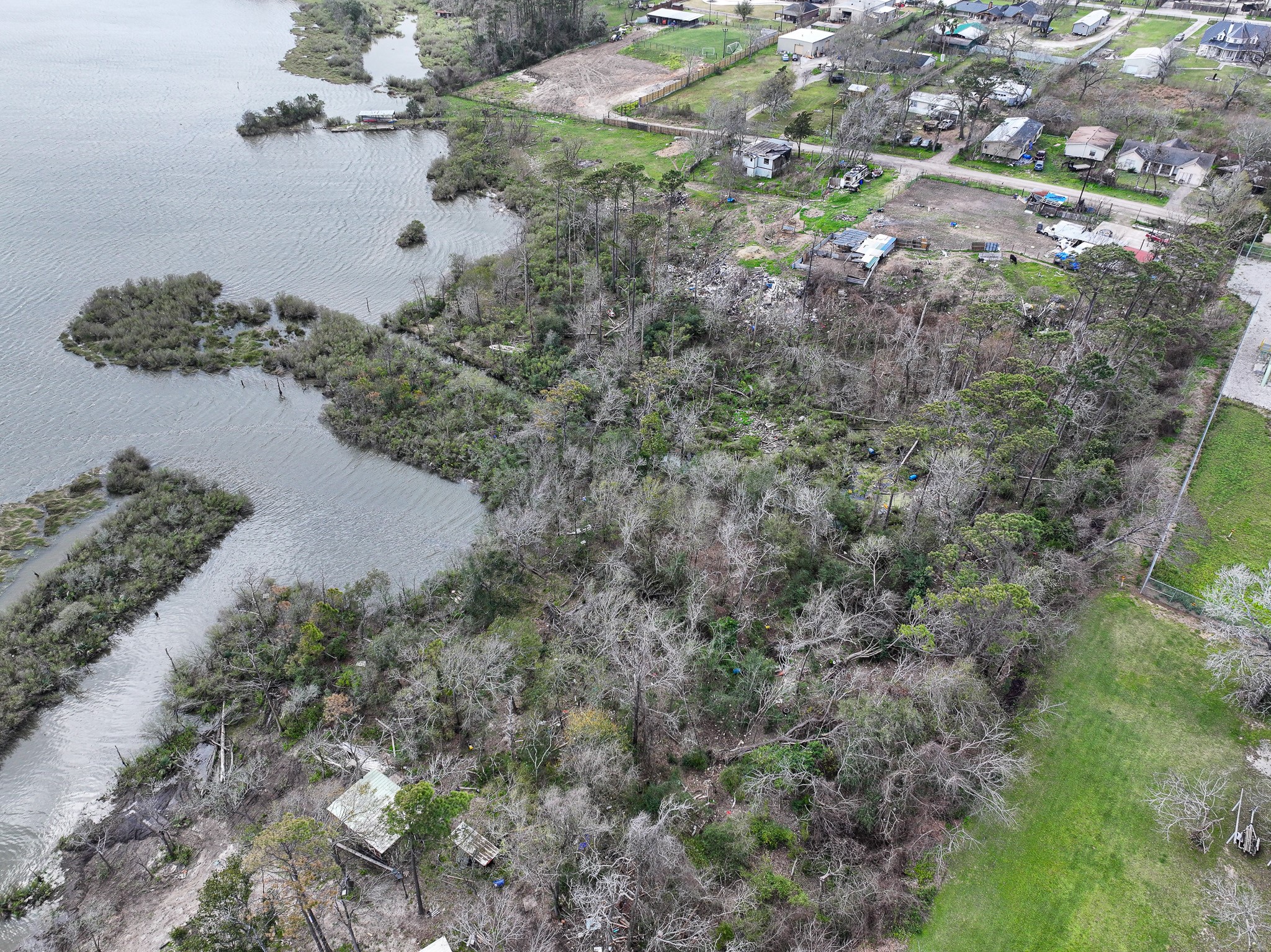 17202 Meadowbrook Drive Channelview, TX 77530 - Photo 12 of 22 an aerial view of a house with a yard and lake view