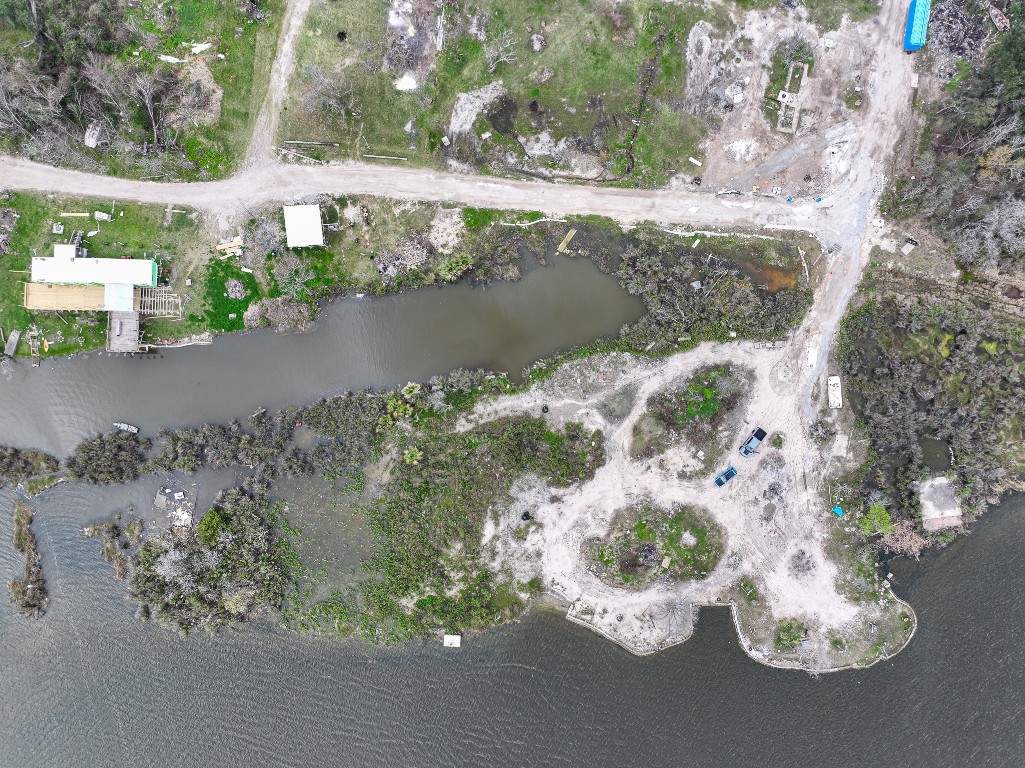17202 Meadowbrook Drive Channelview, TX 77530 - Photo 18 of 22 a view of a lake with a yard