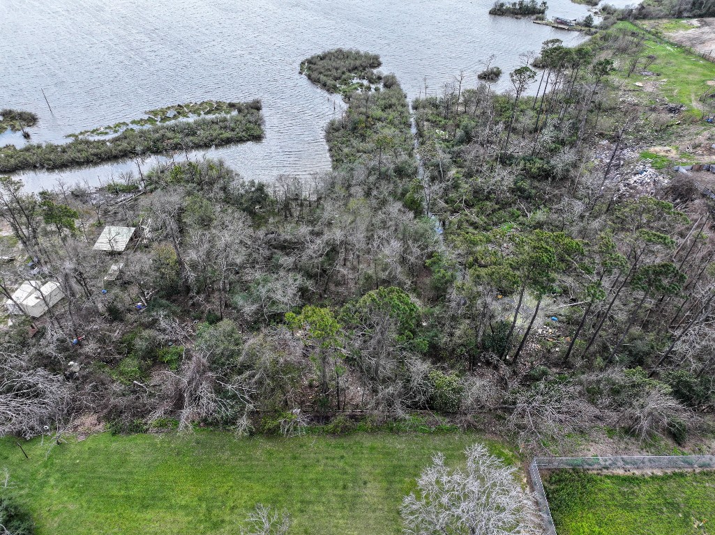 17202 Meadowbrook Drive Channelview, TX 77530 - Photo 5 of 22 a view of a lake with a yard