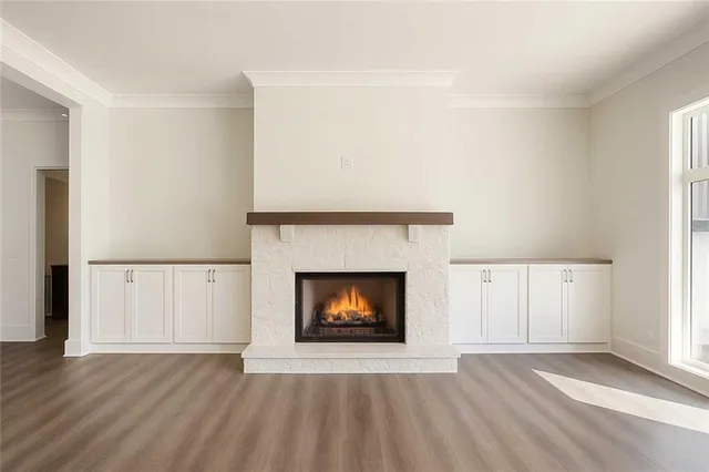 a large kitchen with granite countertop a stove and a sink