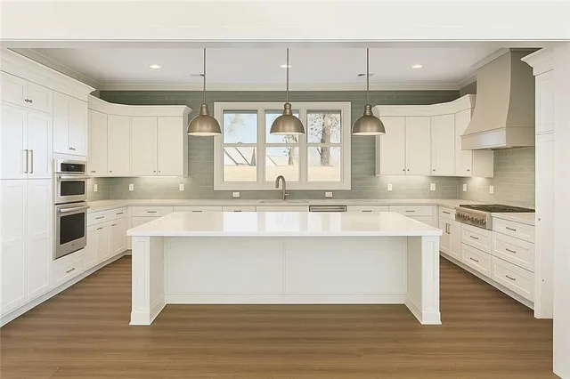 a view of a room with a table and chairs