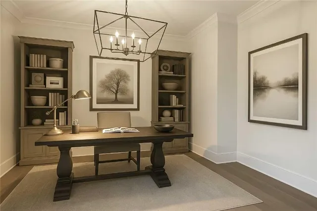 a view of a room with wooden floor and a window