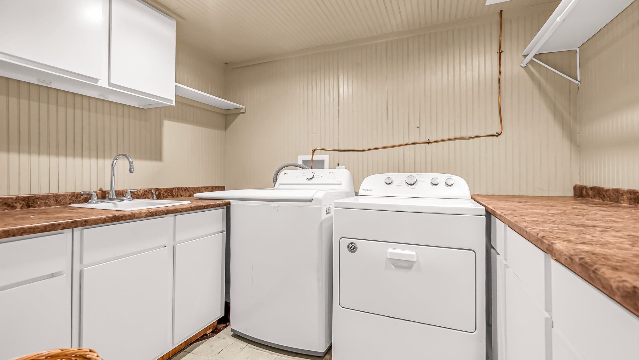208 3rd Street Parachute, CO 81635 - Photo 29 of 40 a utility room with dryer and washer