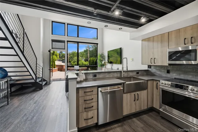 a kitchen with stainless steel appliances granite countertop a stove and a sink