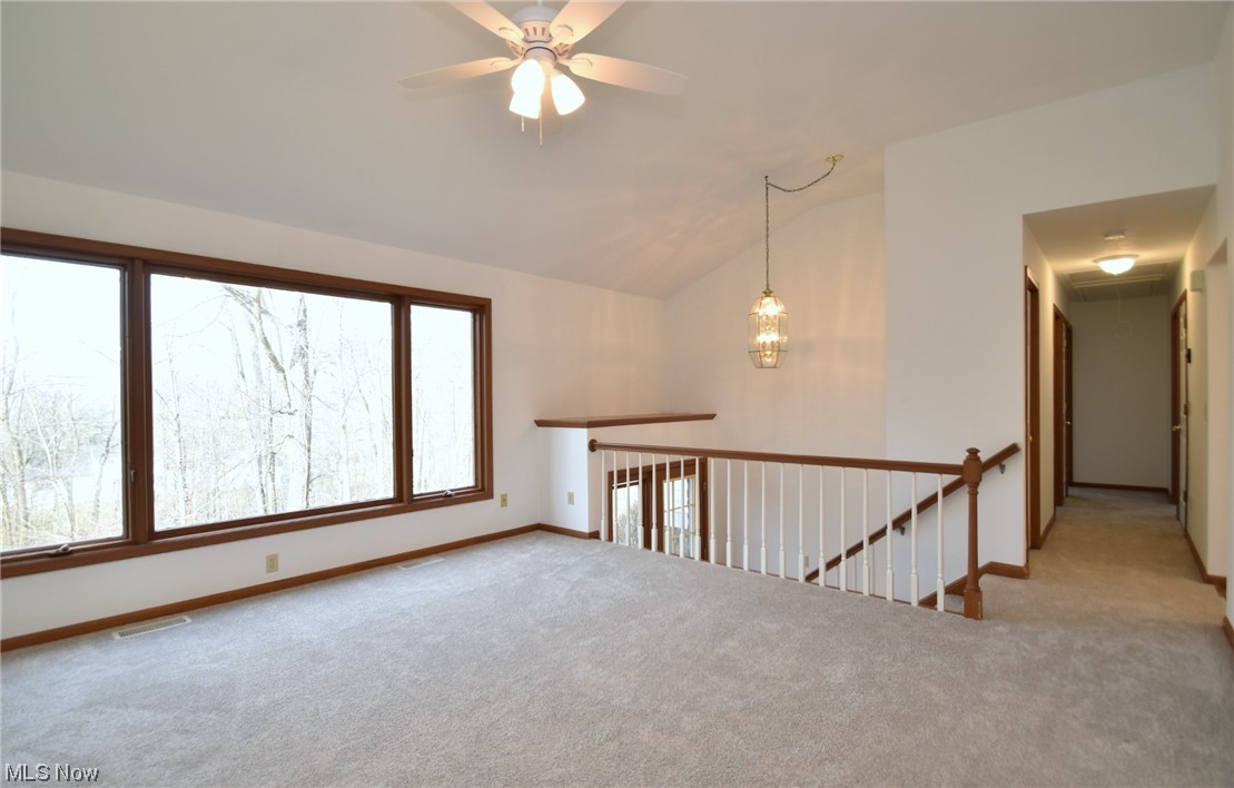 9699 Mulberry Road Chardon, OH 44024 - Photo 4 of 24 Living room featuring light colored carpet, ceiling fan, and lofted ceiling
