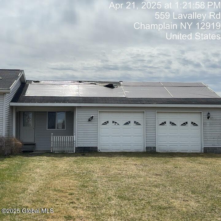 559 Lavalley Road Champlain, NY 12919 - Photo 2 of 19 559 Lavalley Rd garage tarp