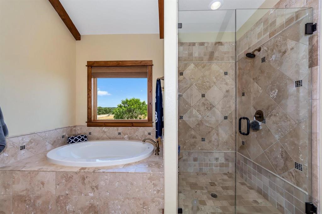 1231 Rawhide Ridge Graford, TX 76449 - Photo 22 of 26 Bathroom with independent shower and bath