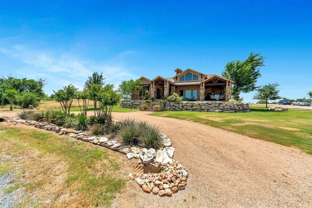 1231 Rawhide Ridge Graford, TX 76449 - Photo 3 of 26 Craftsman-style home featuring a front lawn