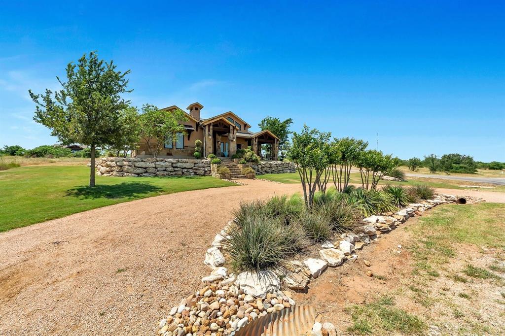 1231 Rawhide Ridge Graford, TX 76449 - Photo 5 of 26 View of front of home featuring a front lawn