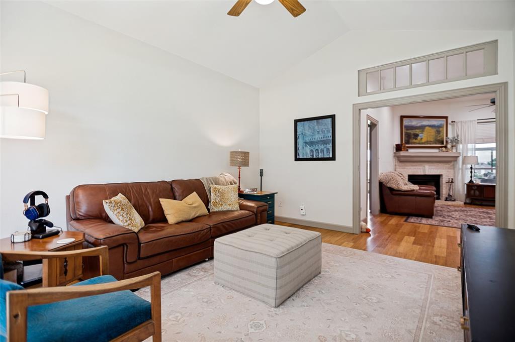 5643 West Caylor Road Fort Worth, TX 76244 - Photo 7 of 37 Vaulted ceiling with a ceiling fan, recessed doorway with transom window, hardwood flooring, and neutral wall tones
