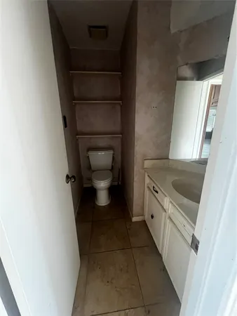 a room with wooden floor and furniture