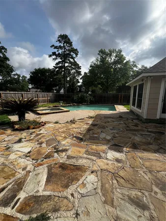 a view of a backyard with green space