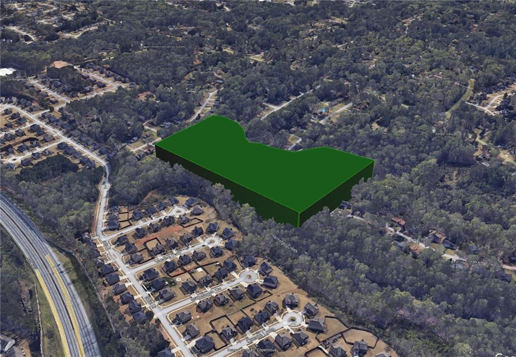 2957 Thompson Mill Road Decatur, GA 30034 - Photo 4 of 9 a green field with some trees in the background