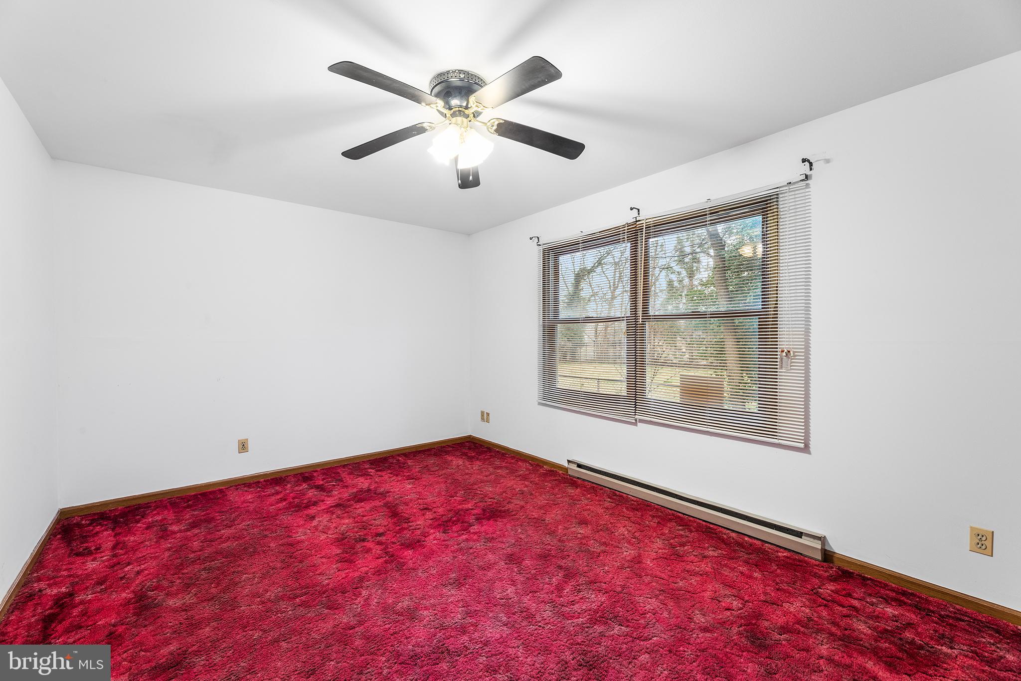 139 Prospect Street Chestertown, MD 21620 - Photo 14 of 28 an empty room with windows and fan